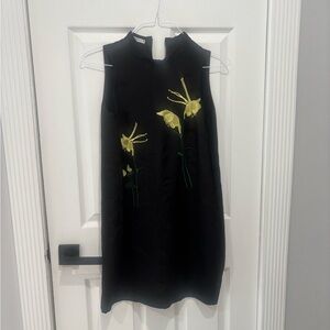 Chic Black Mini Dress with Yellow Floral Accents